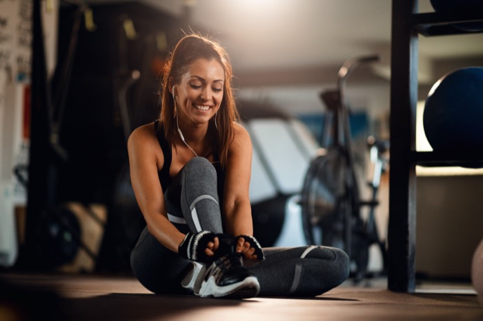 Woman training with dumbbells
