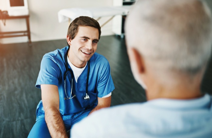 Physical therapist speaking with a patient